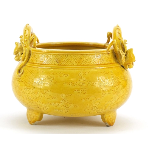 528 - Chinese porcelain yellow glazed tripod censer with dragon handles, incised under glaze with a dragon... 