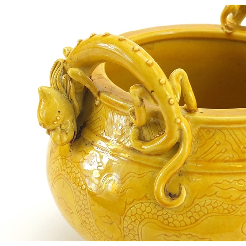 528 - Chinese porcelain yellow glazed tripod censer with dragon handles, incised under glaze with a dragon... 