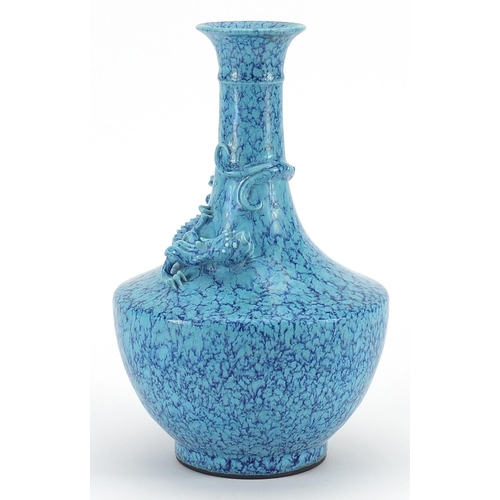 397 - Chinese porcelain vase having a blue glaze decorated in relief with a water dragon, impressed six fi... 