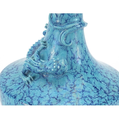 397 - Chinese porcelain vase having a blue glaze decorated in relief with a water dragon, impressed six fi... 