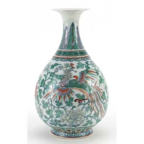 559 - Chinese doucai porcelain vase hand painted with a phoenix and dragon amongst flowers, 28cm high