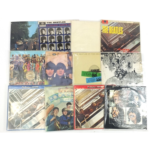 623 - The Beatles vinyl LP's including The White Album with poster and four photographs, Abbey Road, Pleas... 