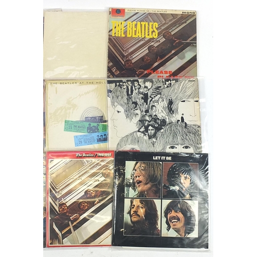 623 - The Beatles vinyl LP's including The White Album with poster and four photographs, Abbey Road, Pleas... 