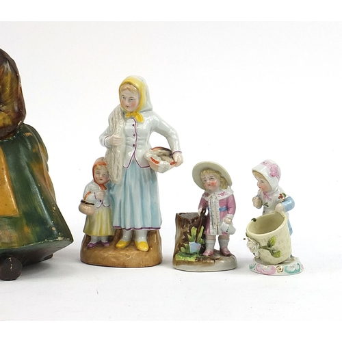 572 - Victorian and later figurines including two Wade cellulose, the largest 26cm high