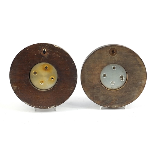 184 - Two Guinness advertising circular oak wall barometers, each 20.5cm in diameter