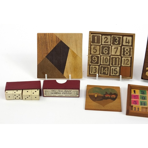 612 - Selection of Victorian and later treen dexterity puzzles including The Zig Zag Crystal Palace puzzle... 