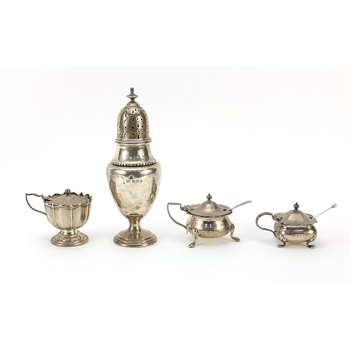 261 - Three silver mustards and a large silver baluster shaped caster by Mappin & Webb, the largest 17cm h... 