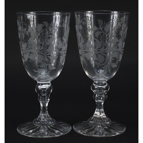 44 - Pair of Edwardian wine glasses etched with leaves and berries, each 18.5cm high