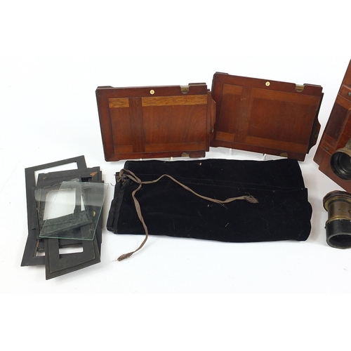 517 - Thornton Pickard mahogany and brass field camera, with different sized plates