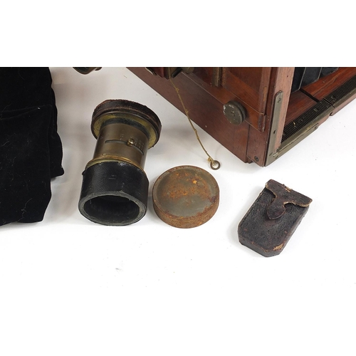 517 - Thornton Pickard mahogany and brass field camera, with different sized plates