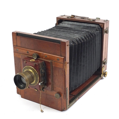 517 - Thornton Pickard mahogany and brass field camera, with different sized plates