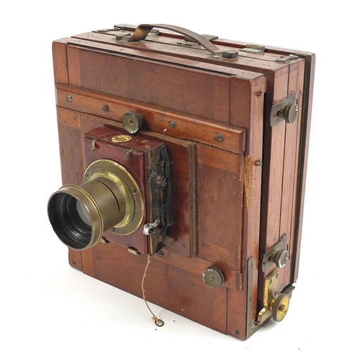 517 - Thornton Pickard mahogany and brass field camera, with different sized plates