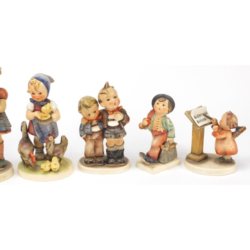 591 - Nine Goebel Hummel figures, the largest 17cm high