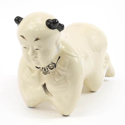 600 - Chinese porcelain figural pillow, 35cm in length