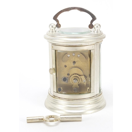 335 - Miniature silvered cylindrical carriage clock with enamelled dial, 8cm high