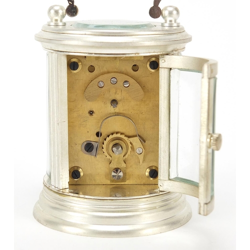 335 - Miniature silvered cylindrical carriage clock with enamelled dial, 8cm high