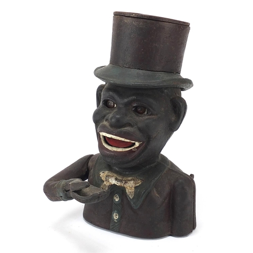 610 - Painted cast iron money bank in the form of a jolly man, 21cm high