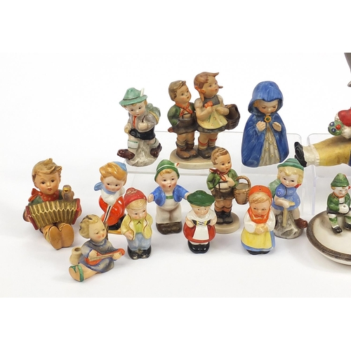 589 - Collection of Goebel Hummel including figure groups, angels and monk salt and pepper cellars, the la... 