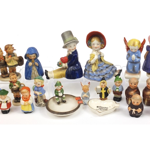 589 - Collection of Goebel Hummel including figure groups, angels and monk salt and pepper cellars, the la... 