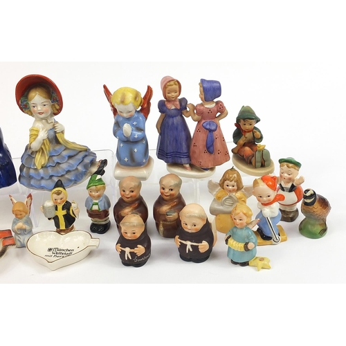 589 - Collection of Goebel Hummel including figure groups, angels and monk salt and pepper cellars, the la... 