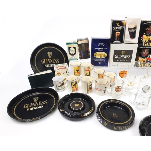 180A - Large collection of Guinness advertising breweriana including glasses, ashtrays, album of postcards,... 