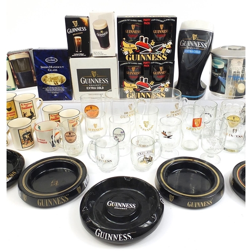 180A - Large collection of Guinness advertising breweriana including glasses, ashtrays, album of postcards,... 