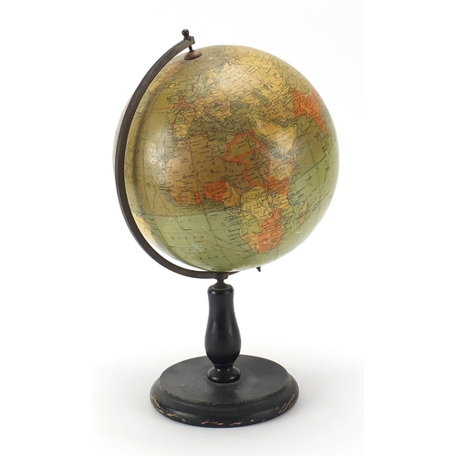 516 - Philip's British Empire table globe with brass arch on ebonised stand, 35cm high