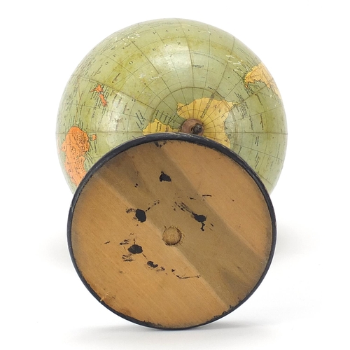 516 - Philip's British Empire table globe with brass arch on ebonised stand, 35cm high