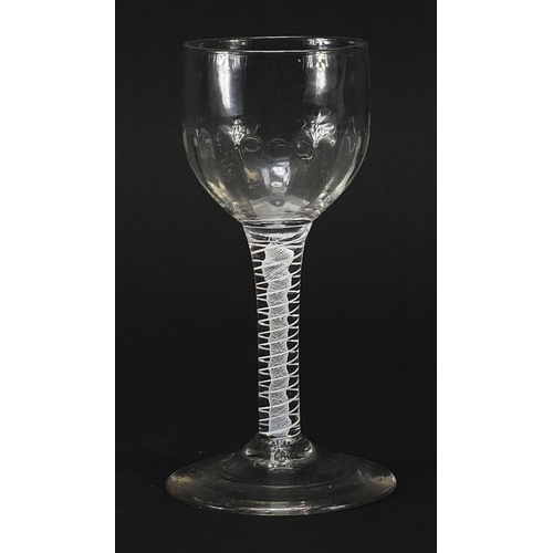 250 - 18th century wine glass with opaque twist stem and facetted bowl, 15cm high