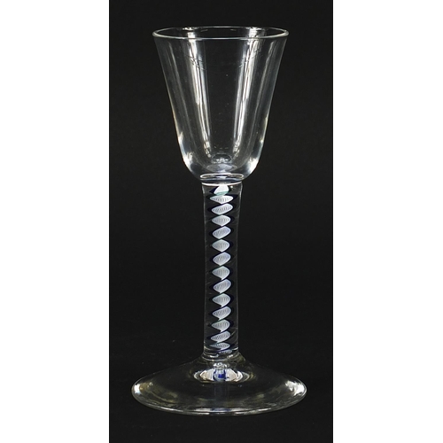 338 - Antique wine glass with blue and white opaque twist stem, 15cm high