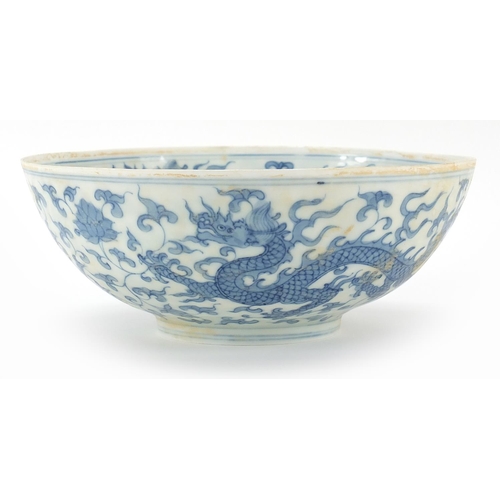 303 - Chinese blue and white porcelain bowl hand painted with dragons and phoenixes amongst flowers, six f... 