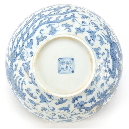 303 - Chinese blue and white porcelain bowl hand painted with dragons and phoenixes amongst flowers, six f... 