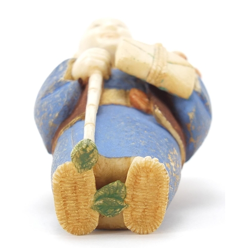 69 - Japanese carved ivory netsuke of an Elder carrying fruit by Ichiro Inada, signed to the reverse, 6cm... 