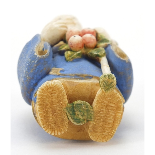 68 - Japanese carved ivory netsuke of an Elder with a staff hold fruit by Ichiro Inada, signed to the rev... 