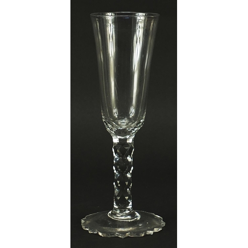 194 - 18th century wine glass with facetted stem, 21cm high