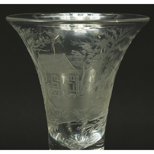 88 - 18th century wine glass with air twist stem and bell shaped bowl etched with figures beside a hut wi... 