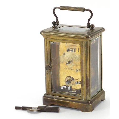 332 - Brass cased carriage clock with swing handle, 11.5cm high