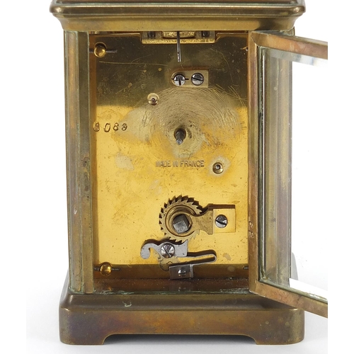 332 - Brass cased carriage clock with swing handle, 11.5cm high