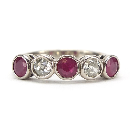 643 - 18ct white gold ruby and diamond five stone ring, size O, 5.0g