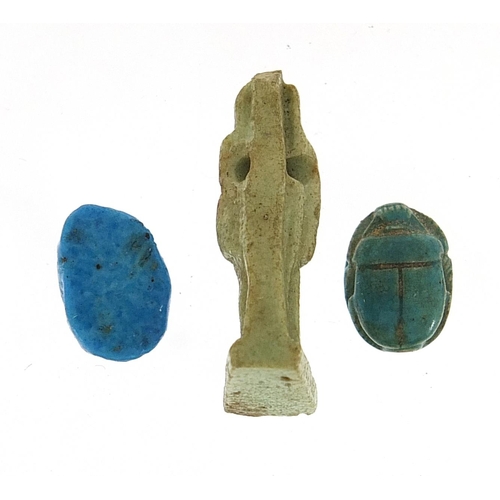 178 - Two Egyptian faience glazed scarab beetle beads and an Isis amulet, the largest 2.5cm high