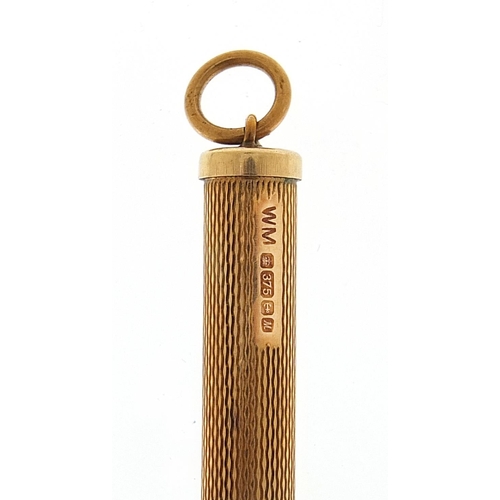 506 - 9ct gold engine turned propelling toothpick, 7.5cm in length extended, 6.7g