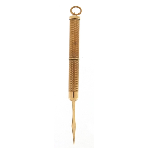 506 - 9ct gold engine turned propelling toothpick, 7.5cm in length extended, 6.7g