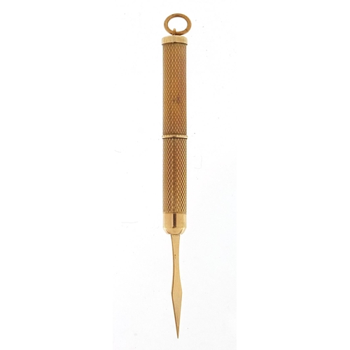 506 - 9ct gold engine turned propelling toothpick, 7.5cm in length extended, 6.7g