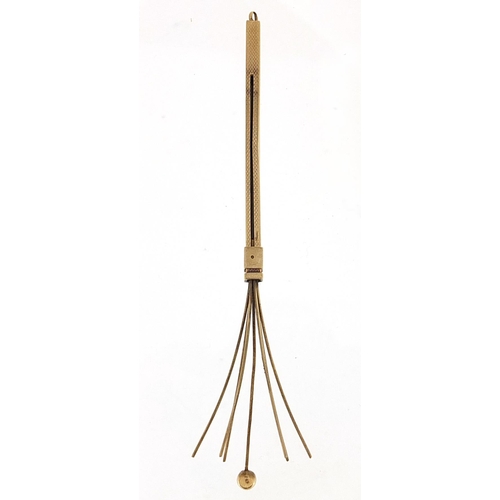 509 - 9ct gold propelling cocktail swizzle stick, 12cm in length extended, 6.5g