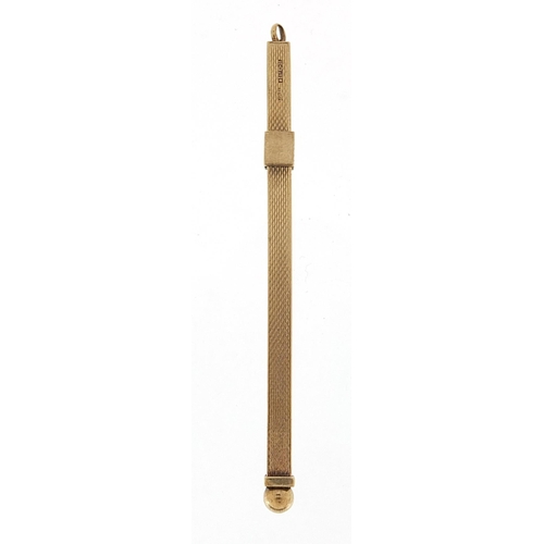 509 - 9ct gold propelling cocktail swizzle stick, 12cm in length extended, 6.5g