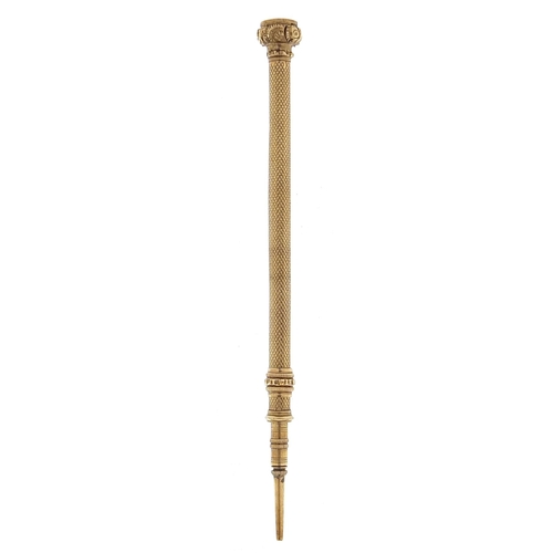 508 - Gold coloured metal propelling pencil set with an amethyst, 9.5cm in length, 6.0g