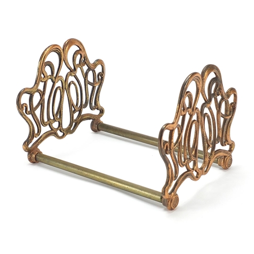 326 - Art Nouveau coppered brass sliding book rack, 21cm adjusting to 36cm