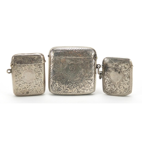 95 - Three Edwardian and later silver vestas with engraved decoration, the largest 5.5cm wide, total weig... 