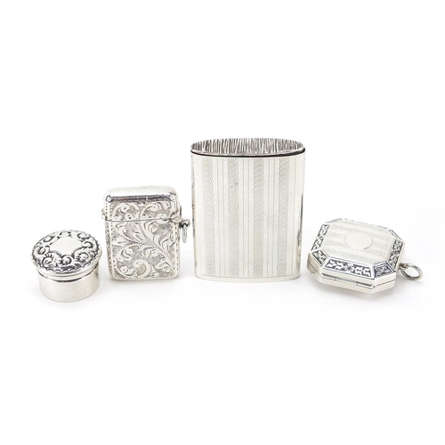 310 - Edwardian and later silver objects comprising two vestas and two pill boxes, the largest 5.8cm high,... 