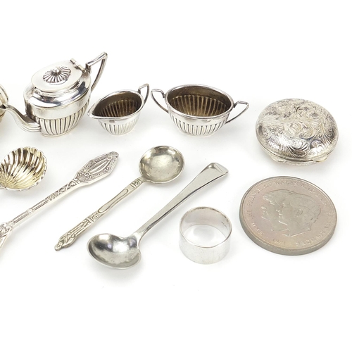 316 - Silver plated and white metal objects including doll's house tea service, pill boxes and mustard spo... 